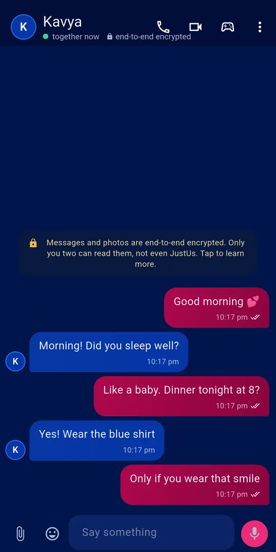 The JustUs chat screen: two partners messaging, with an end-to-end encryption notice